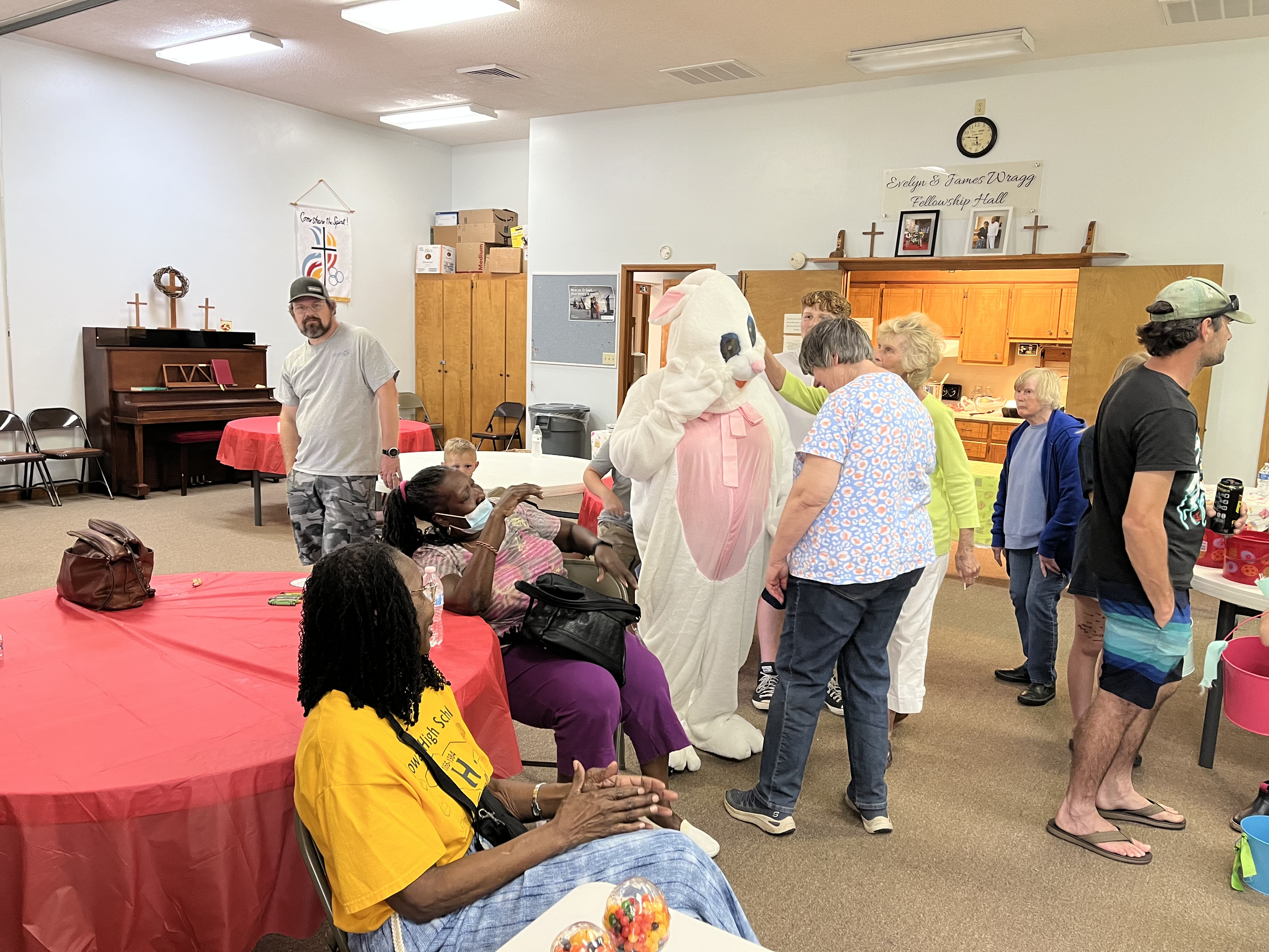 Members of the Trinity Lutheran Church community gathered in fellowship hall for a church event.