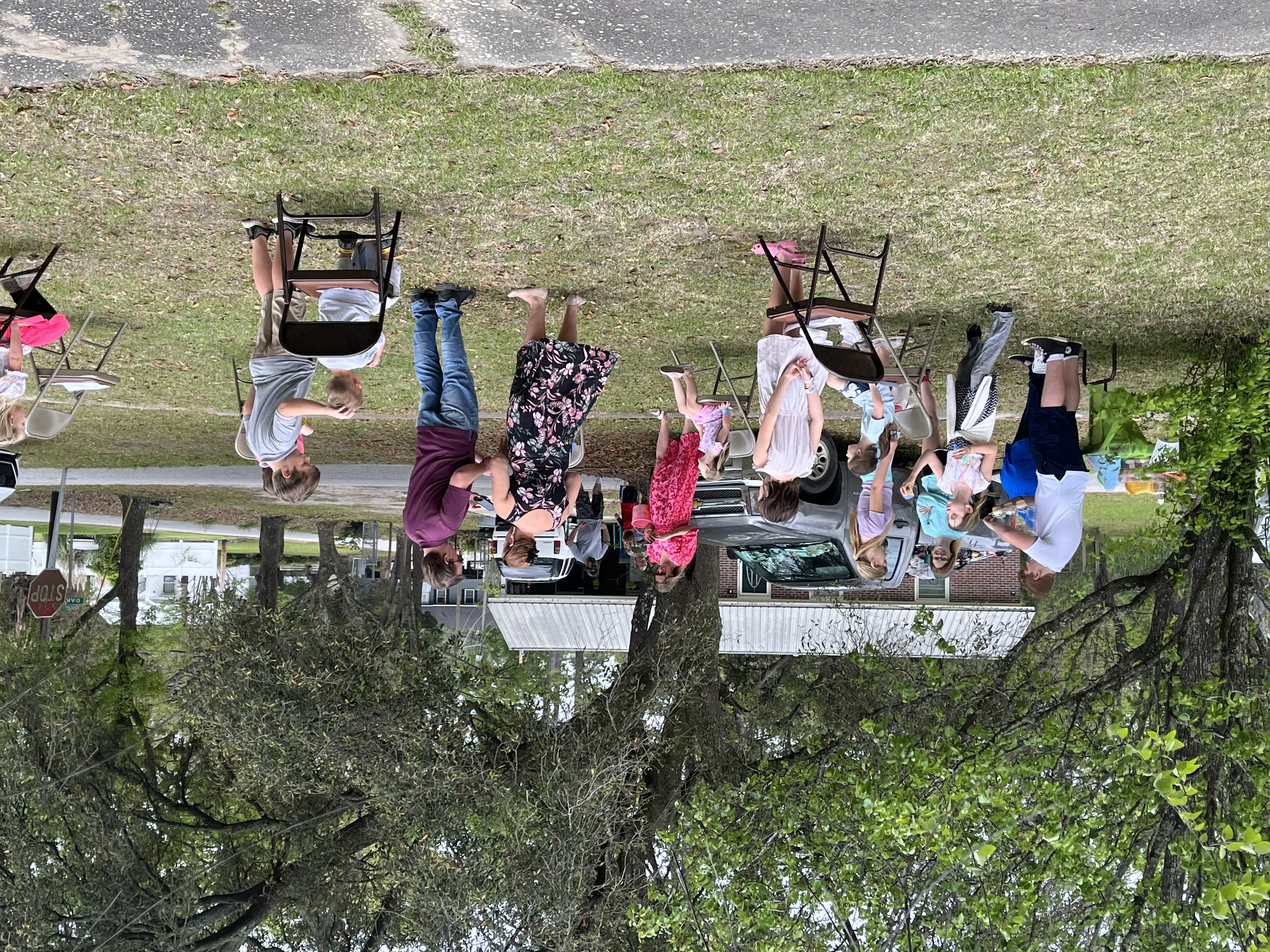 Families and children gathered outdoors during a Trinity Lutheran Church community event.